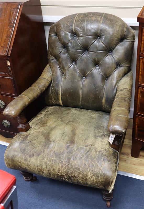A late Victorian library chair upholstered in green leather